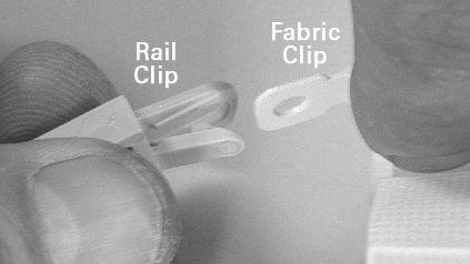 exactly vertical when viewed from both the front and the side. 1. Detach the rail clips from the fabric clips. To detach, twist the rail clip while holding the base of the fabric clip in place.