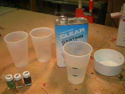 I am using 3 colors for this blank so you will need 3 cups First thing I do is mark my mold for where I want to fill it to.