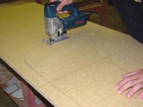 Using a jig saw make the cutout. When doing more than one sink of the same design, save time by making a wood template and using a router.