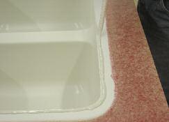 Apply a continuous bead about 1/8" back from the inner front edge of the sink.