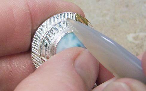 Tumble the add earring posts without soldering Follow these steps to learn how to use oil paste to join earring-post findings to fired metal clay pieces.