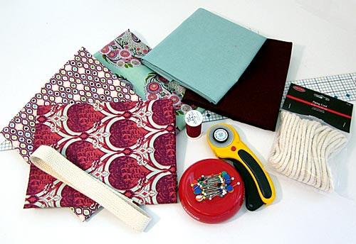 Scraps of various cotton fabrics or ¼ yard cuts; we recommend THREE coordinating print scraps and TWO coordinating solid scraps Scrap or ¼ yard of lightweight batting 1¼ yards of ⅛" piping cord Scrap