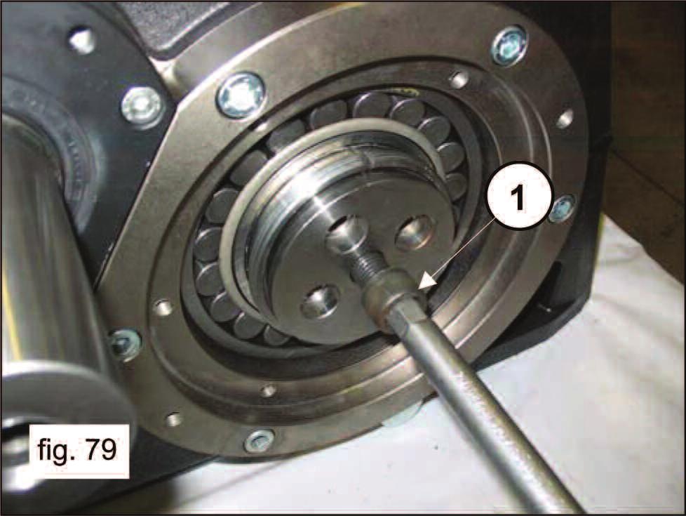 Insert the bushing locking flanges into the conical bushings (pos. 1, fig. 78).