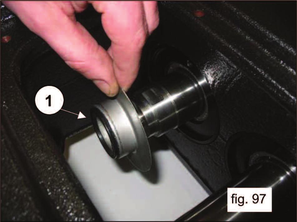 Screw in the oil seal covers using 2 M6X30 grub screws (pos. 1, fig. 96).