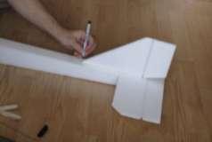 Place the rudder on top of the fuselage and horizontal tail piece, so that the back of the