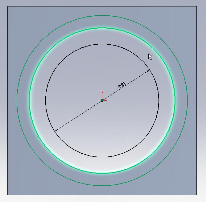 This line colour change indicates that the circle is fully defined. 3.14 Now, extrude these two circles 1mm in towards the part (i.e. so that this does not protrude from the part).