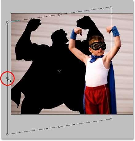 With Layer 2 still selected in the Layers palette (the currently selected layer is highlighted in blue), press Ctrl+T(Win) to bring up Photoshop s Free Transform box and handles around the shadow and