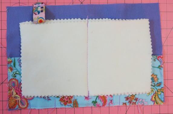 Sew the felt pages to the center of