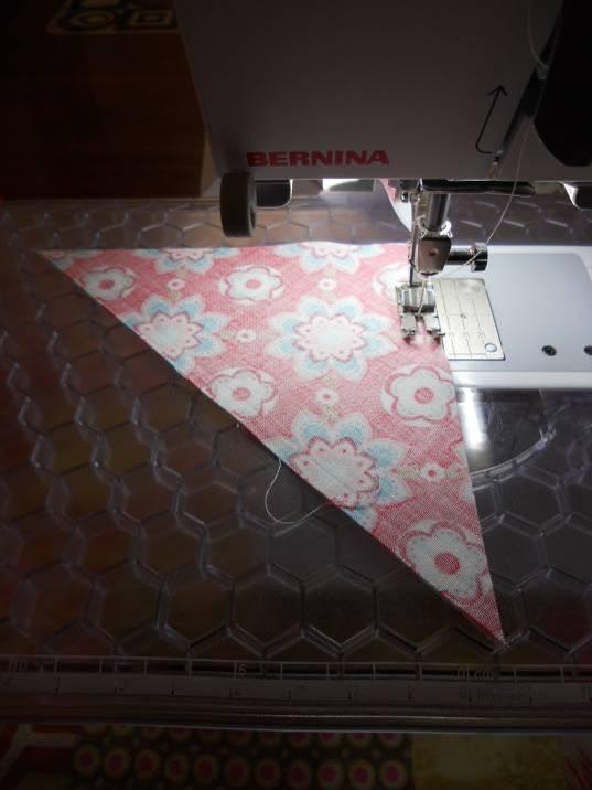Sew all triangles with the medium/dark fabric on top as pictured so