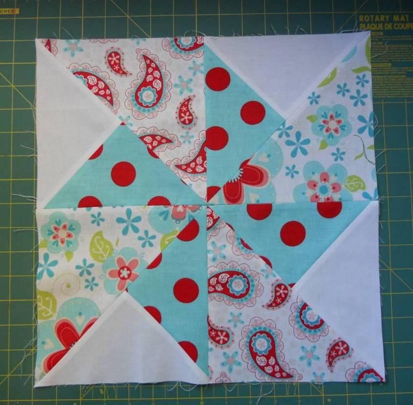 Sew two squares together, using the picture as a guide to ensure that they are