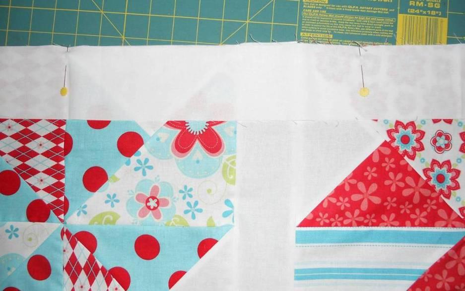 When you are happy with the placement of each block, add a 3 x 14 ½ short white sashing strip between the blocks. Sew the blocks and short sashing strips together in rows and press seams.