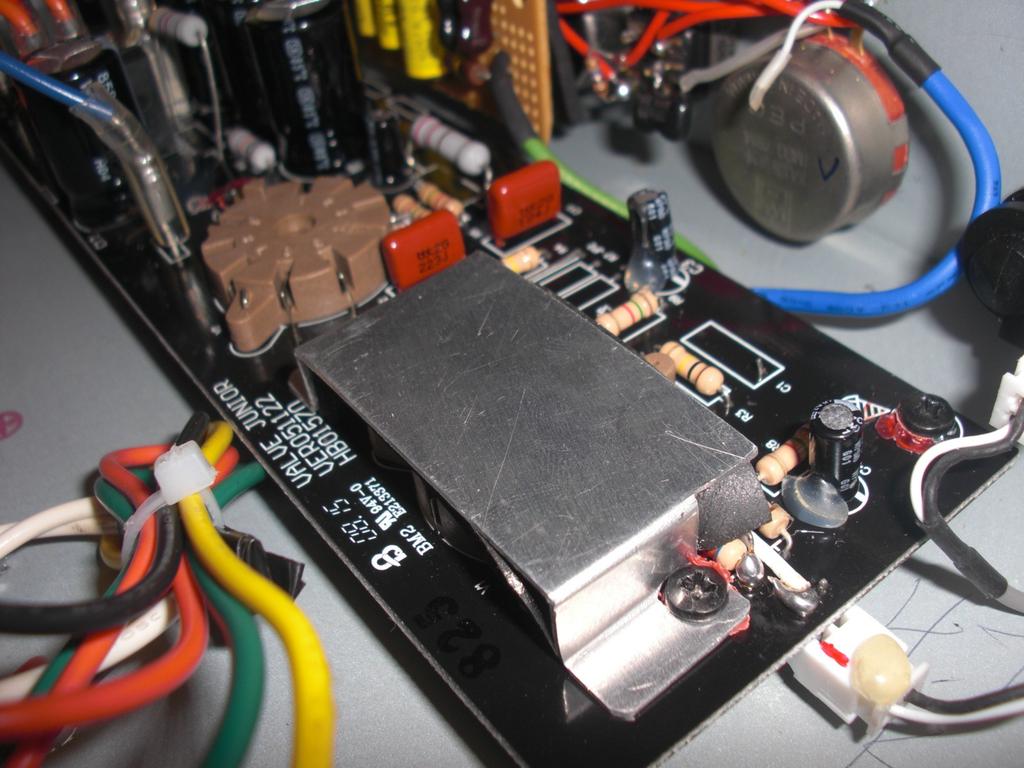 8. Addition of preamp tube shield The final modification made to the amplifier was the addition of a preamp tube shield.