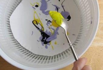 inside of a salad spinner. Spin! What happened to the paint? What does it look like to you?