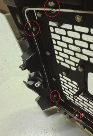 Examine the mounting tab locations. Note where the bolt will go in each location. Trim plastic from the area outside the mount location as needed.