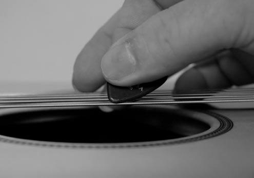 When you strum the guitar it should be a comfortable and natural feeling.