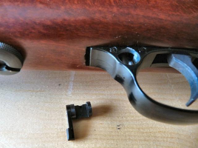 KEEP THE SAFETY IN A SAFE PLACE AFTER REMOVAL REMOVE THE THUMB SCREW FROM UNDERNEATH THE STOCK AND KEEP IT SAFE, THIS MAY BE TIGHT SO USE A CORRECT SIZE ALLEN KEY THROUGH THE SLOT FOR LEVERAGE.
