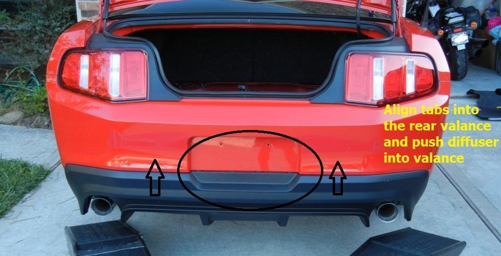 With the Stock Diffuser / Valance and Rear Fascia completely disconnected, simply pull off the stock diffuser (the black part) from the fascia and separate into the two pieces.