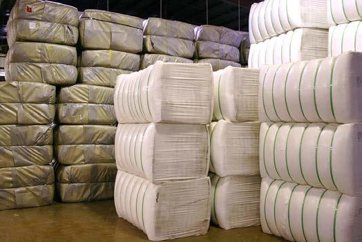 Huge bales of fiber from 400 to 700 pounds each, depending on the fiber are delivered to a yarn plant for processing.
