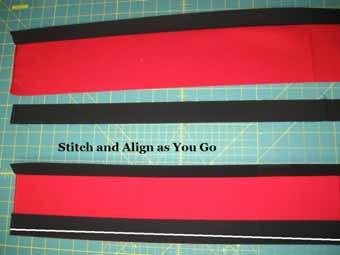 Place the Black strip onto the Red Strip with right sides together and stitch a 1/4" seam along