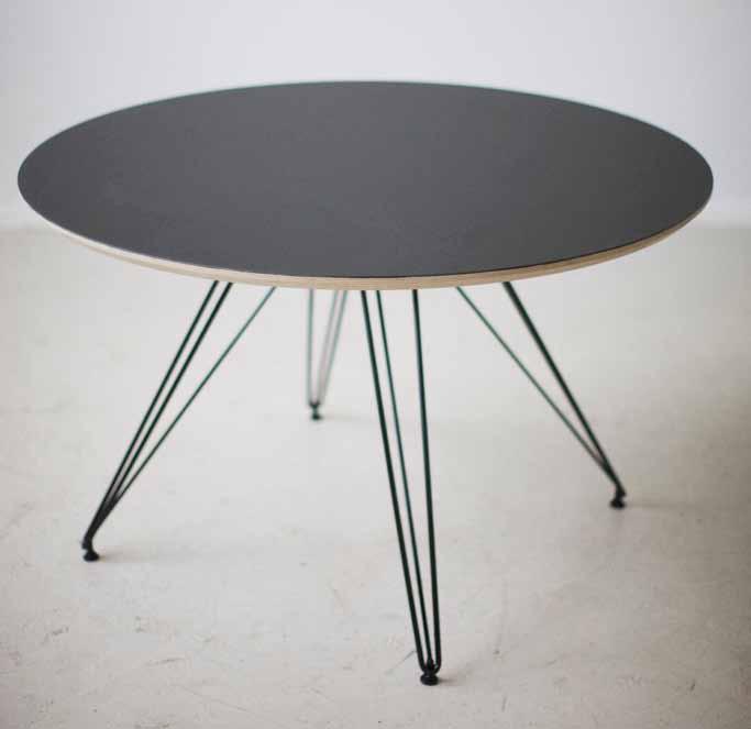The base is made of a solid steel rod construction, while the plywood table top comes either with furniture