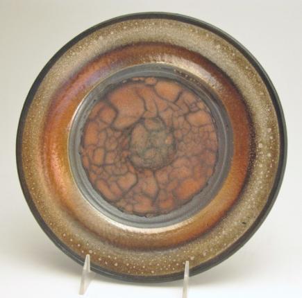 crackle on earthy orange center with a dark surrounding band.