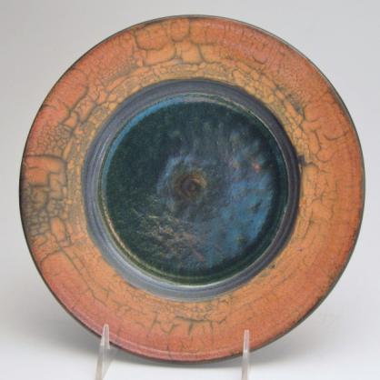 $85 343 Branch and Leaf 3 Lustrous Raku Plate, Lustrous all over, glossy medium orange in center with brick red orange wax trailed resist leaf/branch pattern, nice orange and turquoise overlap