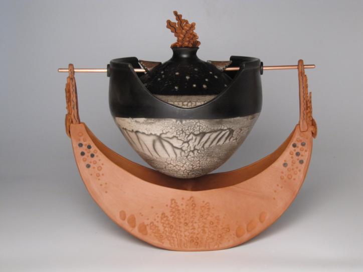 146R Mother Boat: Hatchery of Impressions This is a large 3 part piece with terra cotta Lantz clay boat and black and white naked Raku slip resist and carbon trap lidded container suspended on a