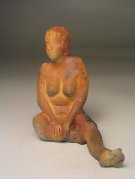 124R Watchful Rest Sitting female figure, smokey orange iron fumed hot from the kiln 20.3x20.