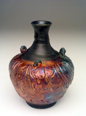 92R Seaweed Brocade Vase with long narrow neck, copper red lustre with small areas of blue