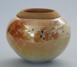388 $140 River and Hemlocks, covered jar with tall lustrous toasty orange lid, flared rim and wide base,