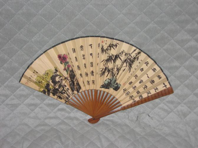 Chinese fans used to be a ways people blocked the sun away and how people fanned there self, and very big and round.