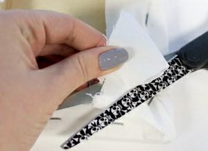 Once you have everything stapled in place on the back, use your scissors to trim away the excess