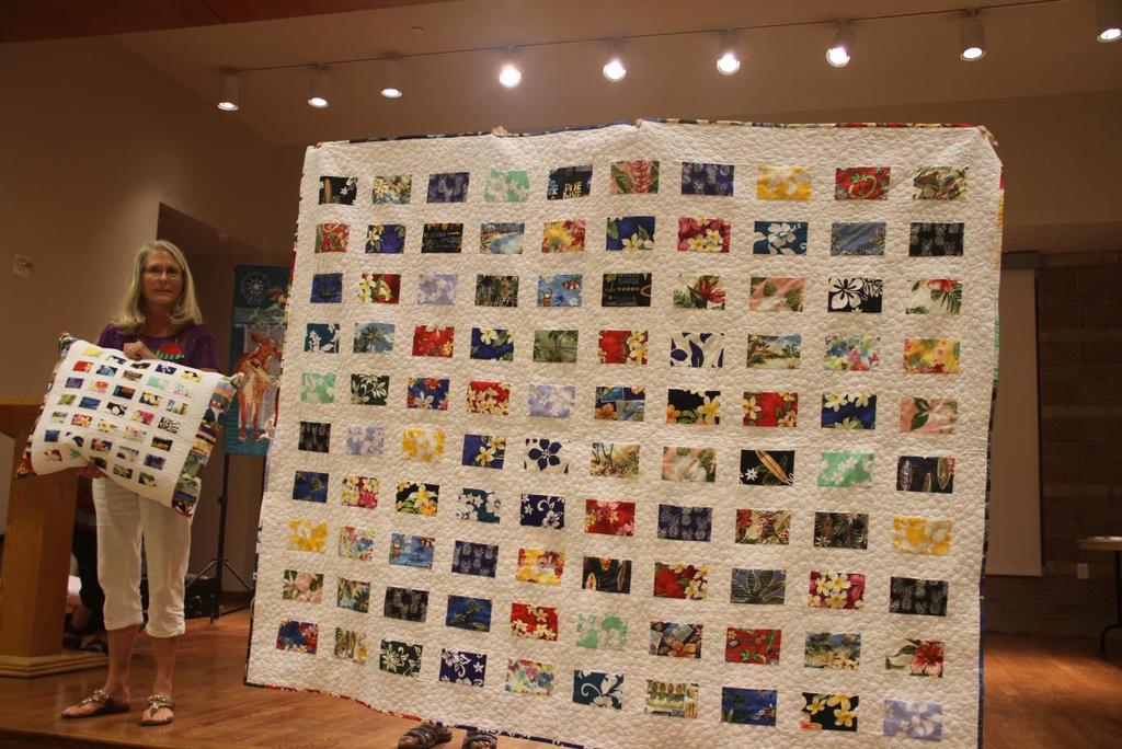 Hawaiian Postcard Quilt Made and Quilted by Charlotte Runyan is for her Grand Daughter, Mia. This quilt has 100 Blocks and 43 different Hawaiian prints.