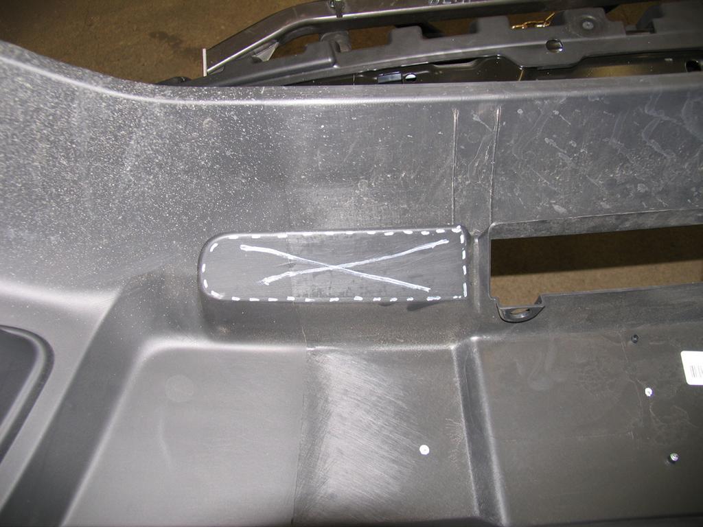 2008-09 vehicles without tow hooks will need to measure and mark a horizontal line in the plastic, as indicated in the photo above, and cut out the area with a utility knife.