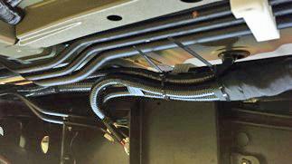 Grommet is flush and fully seated Wire tie #14 C-cab only (b) Route the bed light main wire harness from the grommet