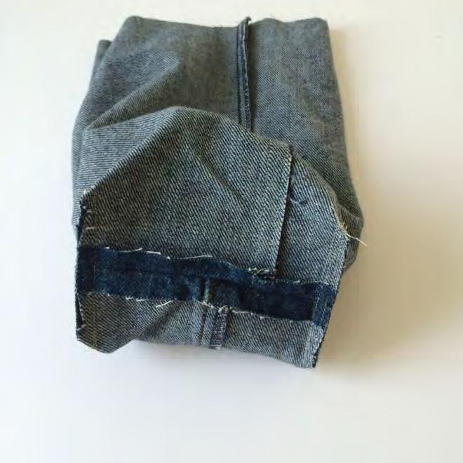 Match up the edges folding the denim at the corner cut and stitch a 1/4 seam allowance across the