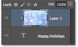 The Layers panel showing the clipping mask. And if we look in the document window, we see that the image on Layer 1 now appears to be inside the text!