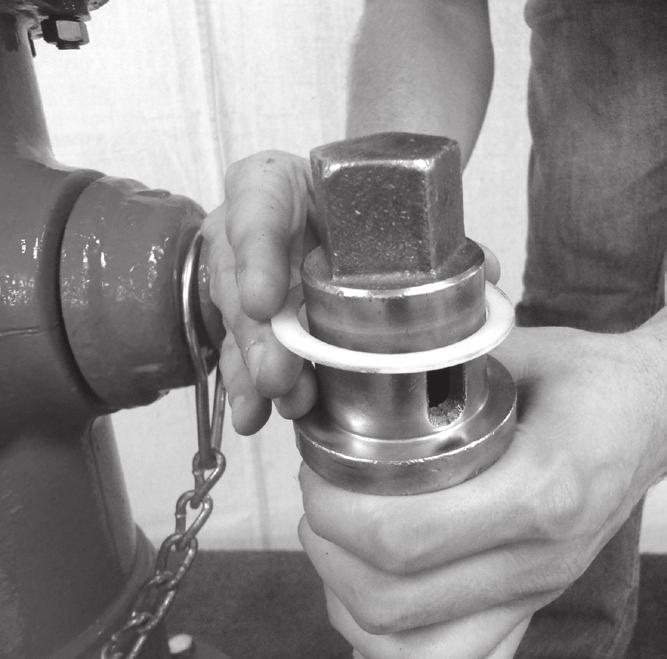 Torque Hold-Down Nut to 200-300 ft-lbs. after Bonnet Bolts are tight. Open Gate Valve. Unscrew one Hose Nozzle Cap slightly to bleed air. Open Hydrant fully.