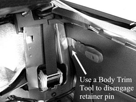 c) Then, use a Door Trim Tool (Fork Tool) to dislodge the pushpin retainer