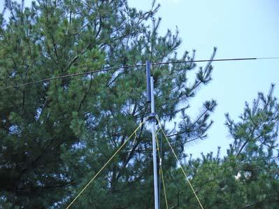 Drill holes in the top section of the mast so that the antenna can be attached. Tune two hamsticks with an antenna analyzer.