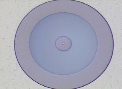 Fig.3-20(a). Then, the Cu metal is deposited by sputtering as the seed layer for electroplating microcoil and contact pad.