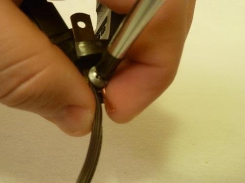 After the screw has been tightened, repeat this process for the hot wire (smooth insulation jacket).