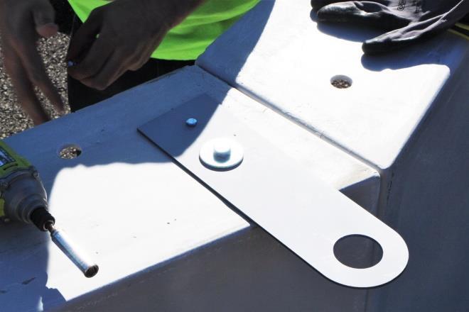 Use a carriage bolt to secure the safety hook while securing the roof sections together.