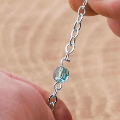 Step 24 Attach the 23-inch length of chain to the end of the 6mm Light Turquoise round bead unit