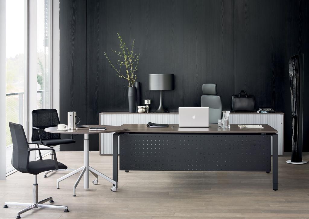 pure The design of the office table range pure creates clarity of form, structures the space and provides for a harmonious blend of architecture and furniture.