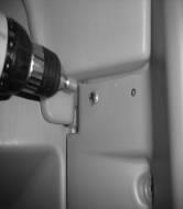 Use screws #14 x 1-1/2" PN 13860 (4) with 3/8 hex nut driver bit, same procedure as fastening roof to panels in the rear