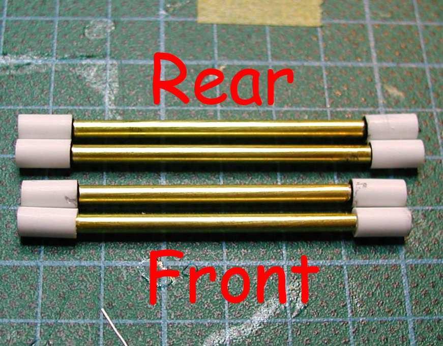 Glue the plastic tubes onto each ends of the brass