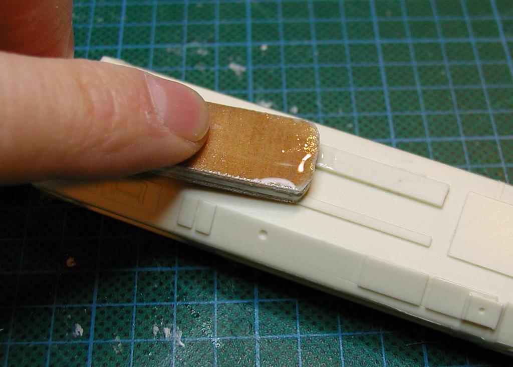 To help the adhesion of the glue, scratch surfaces that will be glued with a coarse sand paper to