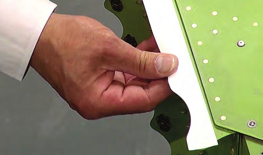 Apply light pressure to the tape, ensuring there are no creases (Figures 4 and 5).