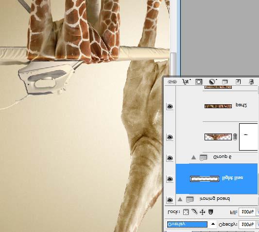 Step 35 Copy neck area from the original retouched Giraffe layer. Paste it into a new layer below ironing board layer.